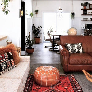 brown moroccan pouf in living room by maison morocco